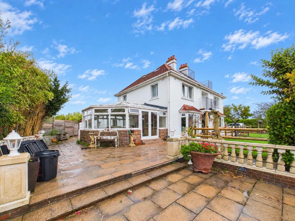 Le vieux beaumont st peter 35021781 sunny blue sky house and garden patio